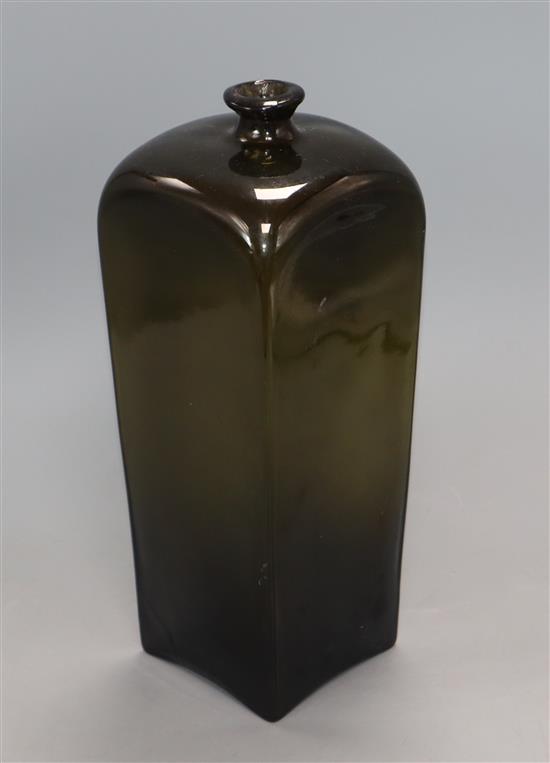 A tall late 18th century dark green glass wine bottle, of square section height 30cm